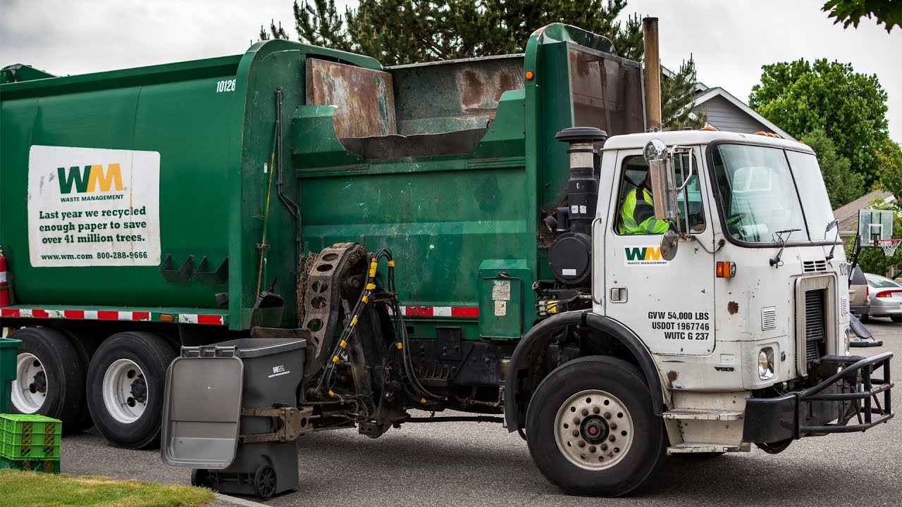 conspiracy theories  - garbage truck - 10128 Wm. Waste Management Last year we recycled enough paper to save over 41 million trees. Are Ol 8002889666 Gvw 54,000 Lbs Usdot 1967746 Wutc G 237