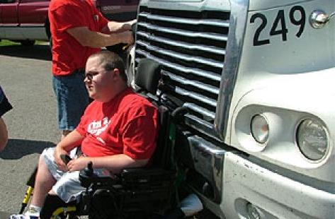 This kid got his wheelchair caught in the grill of a semi truck. he traveled 5 miles at 55 miles an hour before cops finally pulled the truck over. the driver of the truck said he had no idea that the kid was there.