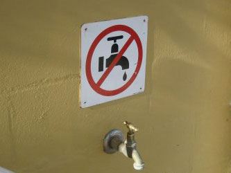 which came first the faucet or the sign