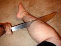 Guy puts a giant knife through his leg