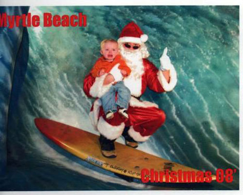 This kid isn't crying because of Santa, he just really, really hates surfing