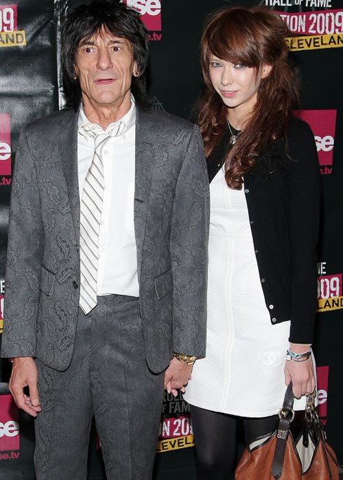 Rolling Stones guitarist Ron Wood, 62, takes 20-year-old girlfriend out for the evening.