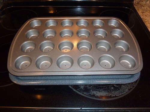 Place the muffin pan on top of the broiler pan.  