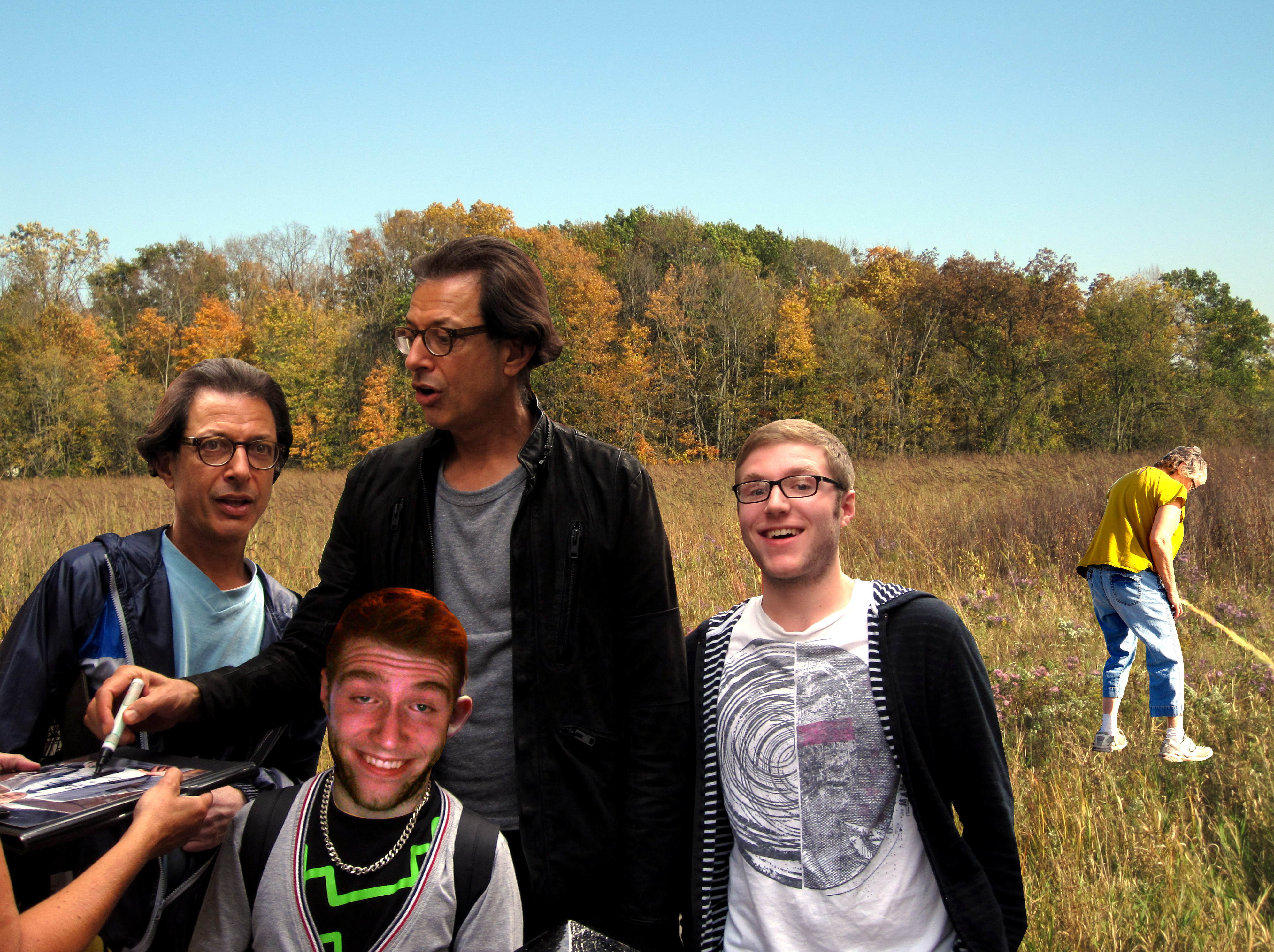 Photo of my cousin at a Jeff Goldblum signing in a field with my grandma peeing in the background.