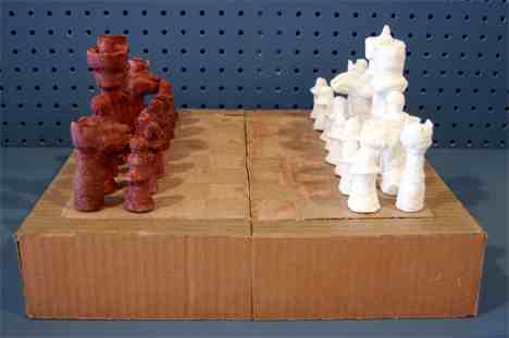 Boredom sets in easily in prison, so prisoners are always coming up with ingenious ways to keep themselves busy. These dice and this beautiful chess set were made of paper mache, which in prison consists of toilet paper, water and glue.