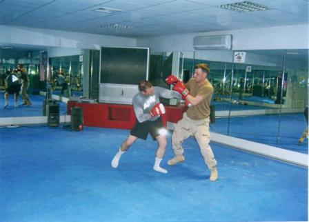 Two Soldiers learning to Box in Iraq.