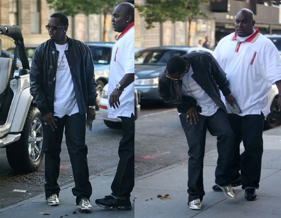 Diddy steps in some dog shit as he gets out of a car.
