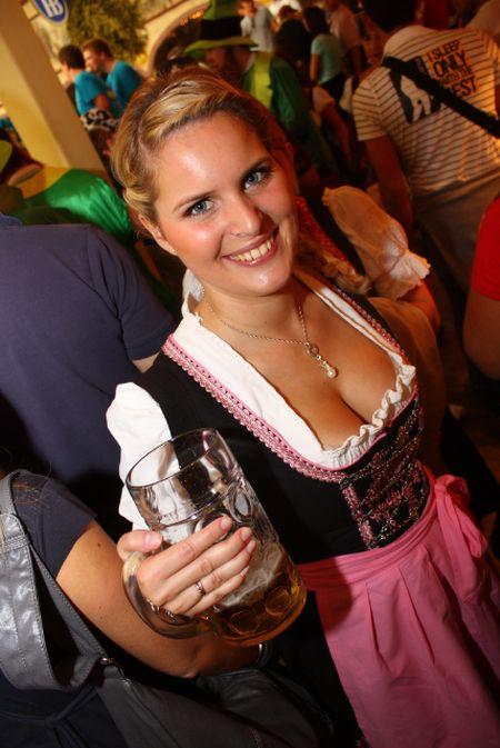 Hot girl at Oktoberfest holding a beer