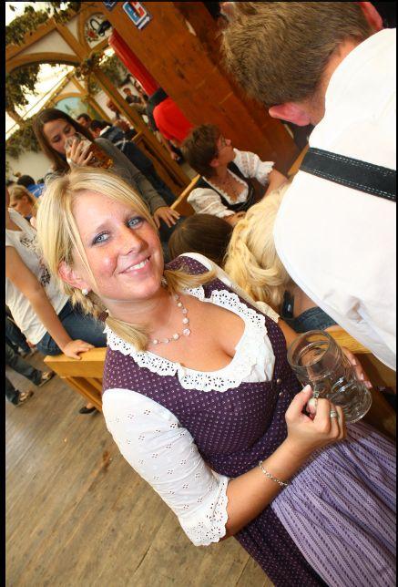 Hot girl at Oktoberfest holding a beer