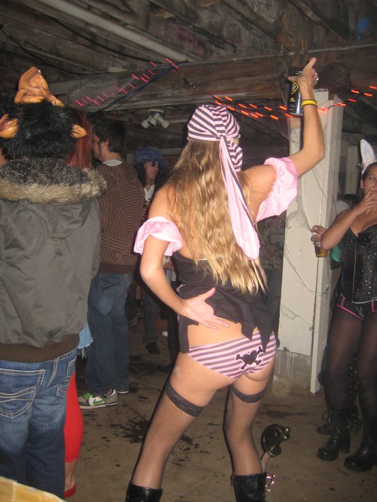 Slutty blonde halloween girl lifts skirt so the whole party can see her panties