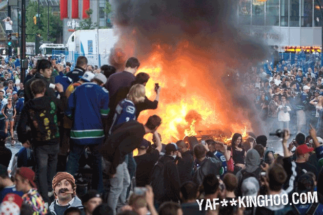 He's back! Forget about that couple kissing on the ground at the Vancouver riot -- it's the Cigar Guy!