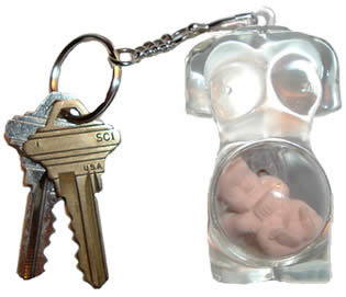 The Pregnant Woman Keychain is a clear plastic woman's torso with a not-yet-born baby floating in the womb. As the photo shows, you can remove (or "deliver") the baby by popping out the ball that the baby floats in.