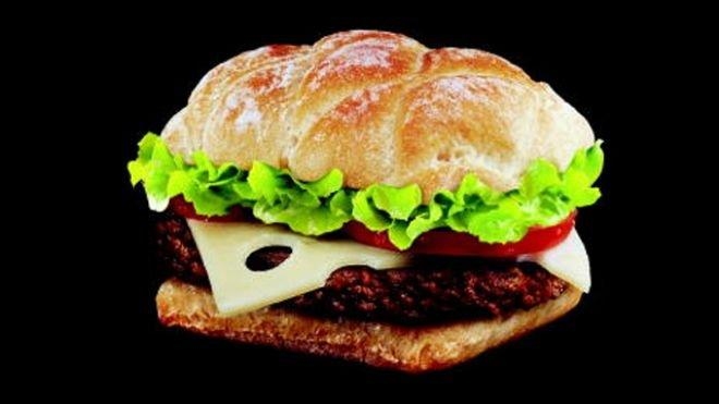 France - "M" Burger - Beef, cheese, lettuce, tomato  natural Emmenthal cheese on a Ciabatta-style roll, baked in a stone oven