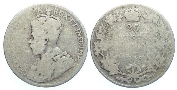 Silver wear. This 1919 king George coin was in circulation for quite some time!