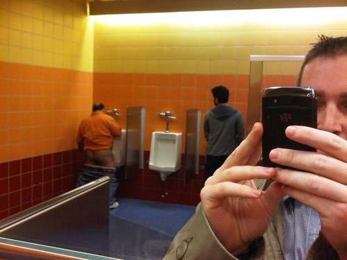 Drunk Miami fan drops his drawers at the urinal... hairiness ensues.