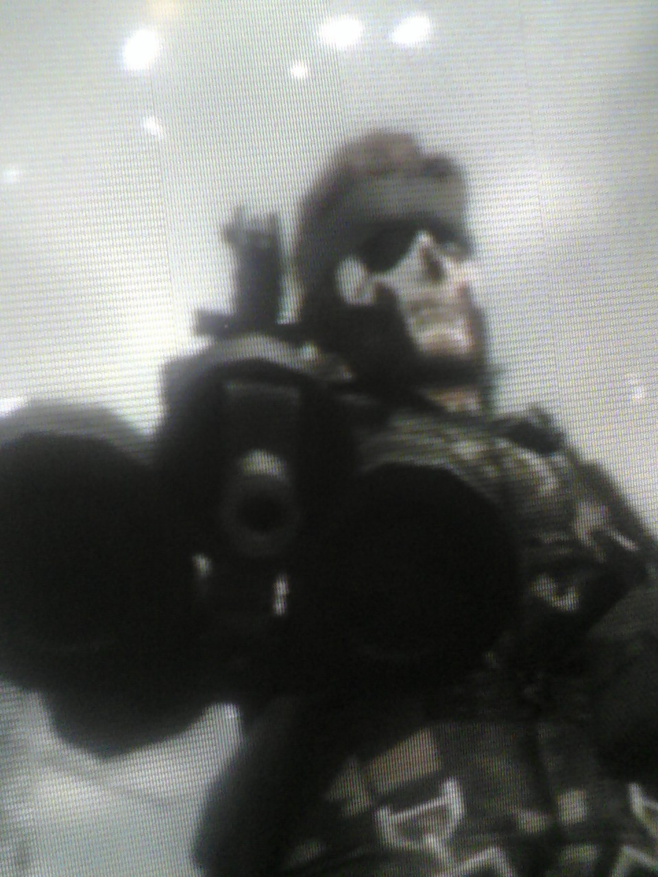 from mgs 3. has on the sorrows camo and zombie facepaint holding the patriot