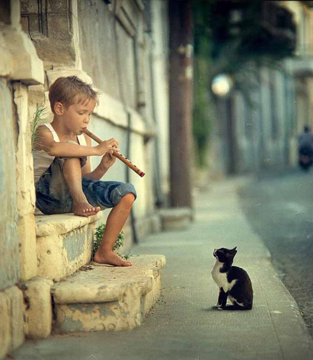 little boy playing flute