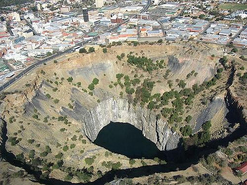Kimberley Big Hole, S. Africa.  Largest hand-dug excavation in the world which yielded over 3tons of diamonds b4 closing in 1914