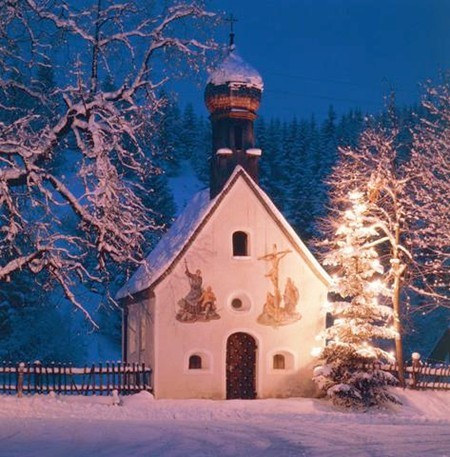Even in its humblest attire, aglow beside a tiny chapel in Germany 's Karwendel mountains, a Christmas tree is a wondrous sight.