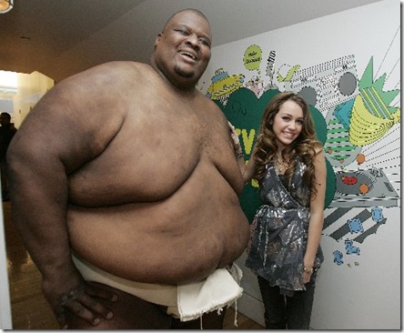 a fat guy with miley cyrus