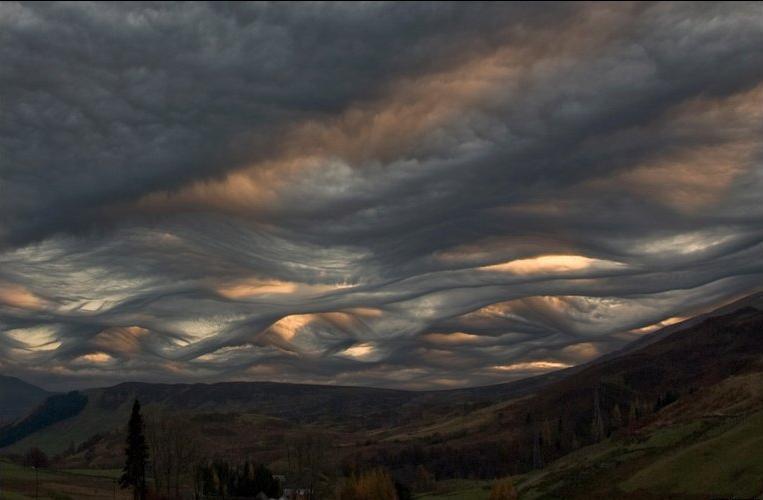 Wind passing around hills create cool cloud effect