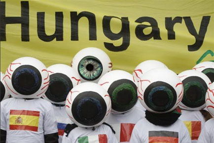 Hungary eyes at a weird Greenpeace protest. 