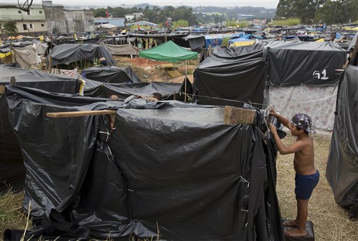 Displaced people who lost their homes because of the World Cup, are building makeshift housing.