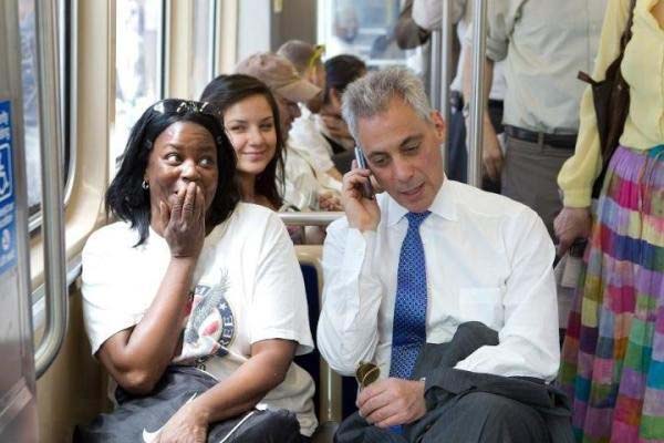 The mayor of Chicago, interrupts this woman's phone interview to give her a recommendation.