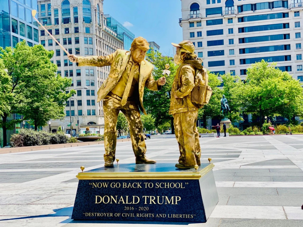 Artist depicts Trump as live statues