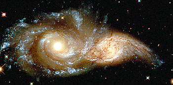 The glowering eyes from 114 million light years away are the swirling cores of two merging galaxies called NGC 2207 and IC 2163 in the distant Canis Major constellation.