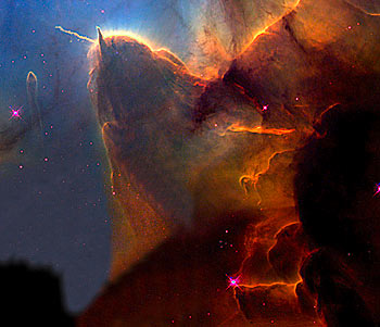 The Trifid Nebula. A 'stellar nursery', 9,000 light years from here, it is where new stars are being born.