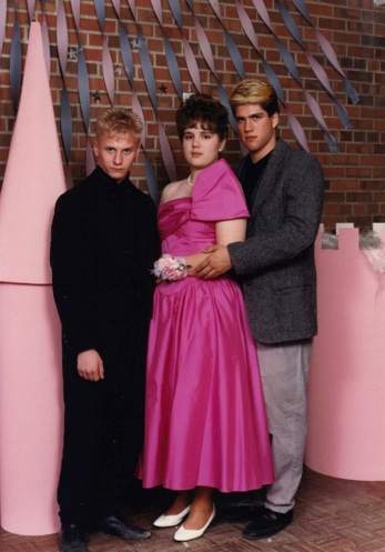 I wonder what bet the guy in the middle lost to have to wear a dress to prom?