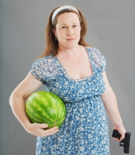 Nothing symbolizes maternity better than a watermelon and a gun