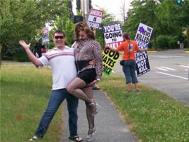 My friend sent this picture of a tranny he found at a hate rally in Seattle.  I don't know how or why, but it is funny and I think the clever people at Ebaums can find a caption for it or make some interesting poster.