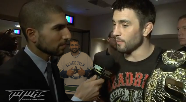 Ariel Helwani UFC 143 Carlos Condit Interview with Photo Bomb by a Vancouver Canuck Fan