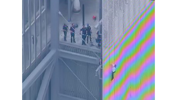 Man scales New York Times building