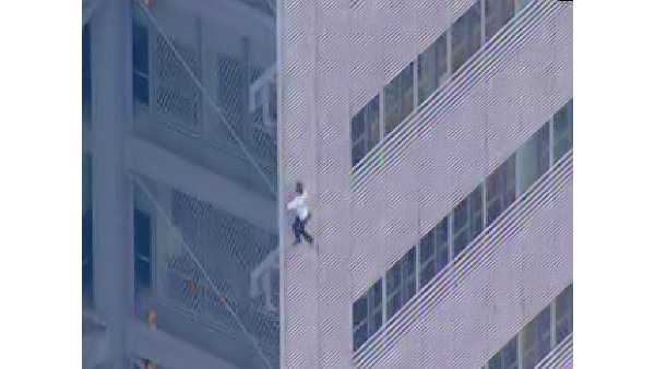 Man scales New York Times building