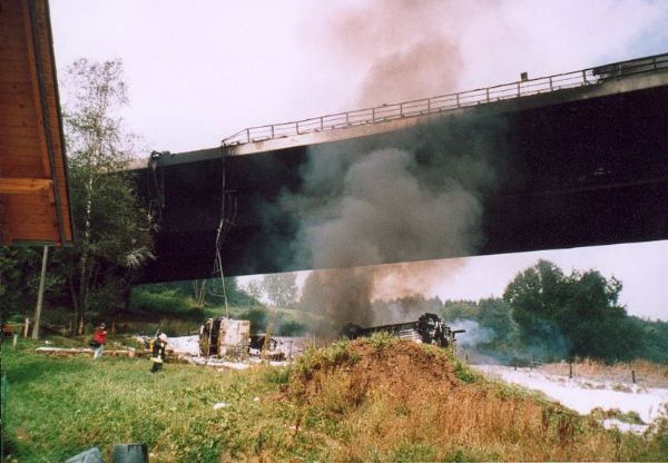 #  10.  Tanker Truck vs Bridge - $358  Million   On  August 26, 2004, a car collided with a tanker truck containing  32,000 liters of fuel on the Wiehltal Bridge in Germany . The  tanker crashed through the guardrail and fell 90 feet off the A4  Autobahn resulting in a huge explosion and fire which destroyed  the load-bearing ability of the bridge. Temporary repairs cost $40  million and the cost to replace the bridge is estimated at $318  Million. 