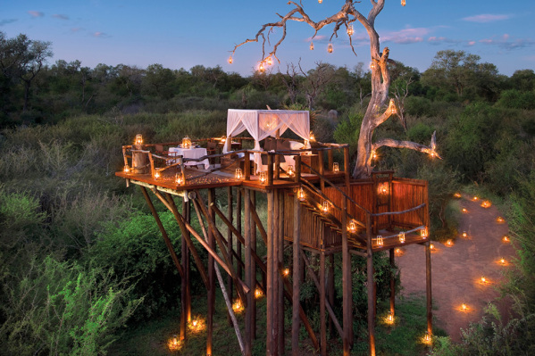 Chalkeys Treehouse at the Lion Sands Game Reserve - I have never seen a hotel room more beautiful or more romantic than this  it is the Chalkey Treehouse at the Lion Sands, a five-star safari lodge in Sabi Sands, South Africa. Enjoy a delicious gourmet meal under the stars and then curl up with your loved one under that white canopy as you fall asleep to the sound of lions roaring nearby.