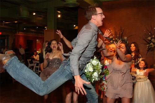 The girls at this wedding sure got competition for the bouquet from this acrobatic gentleman.
