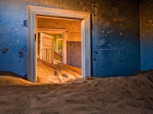 Kolmanskop, Namibia - In the southern area of the coastal African nation of Namibia you will find the Namib desert. And in this desert, you will find Kolmanskop, a ghost town that was abandoned in 1954. The town was first founded in 1908. A town was built there because diamonds were found in the area and it became a popular spot for diamond miners until the supply of diamonds began to diminish in the 1920s. Once the diamonds disappeared, so did the residents in an exodus similar to that of many gold rush ghost towns in the western United States.