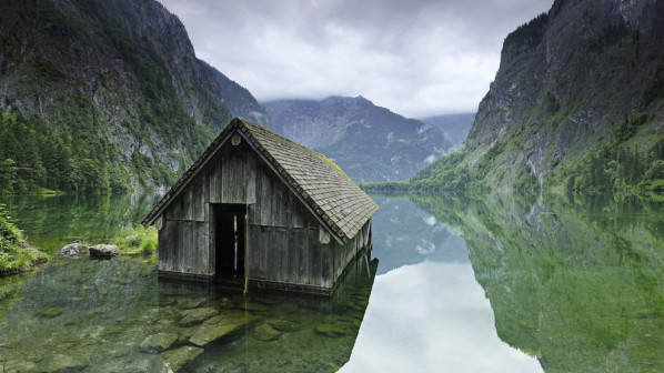 Fishing Hut in Germany - This abandoned fishing hut was discovered in a lake near the German Alps. It was reportedly completely empty when it was found and there is no solid information about when it was built or who it's original inhabitants were. It's likely that this was built for use by recreational fishermen to live and fish in during the spring and summer seasons.