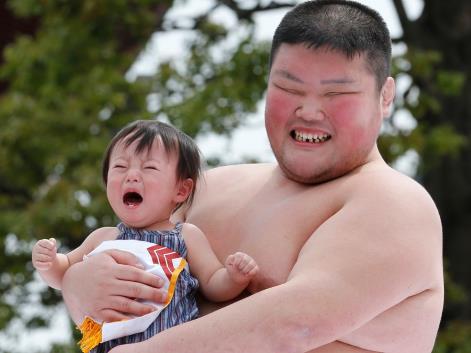 In Japan, it's good luck when sumo wrestlers make babies cry, May 2013