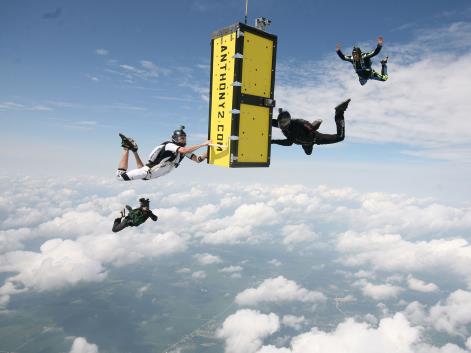 An escape artist successfully completed a stunt that saw him being pushed out of a plane inside a locked coffin, August 2013