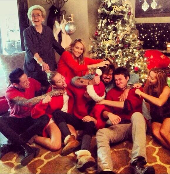 The Cyruses - Miley isn't wearing pants in this year's Christmas photo. Because of course.