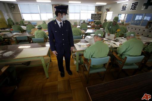 Prison for the elderly - Japan - This prison guard watches over elderly inmates on their work shift in in Onomichi, Japan