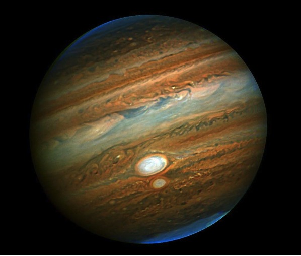 Jupiter's Mass and Gas - Jupiter is so large that all the other planets in the solar system could fit inside of it yet there is no surface to land on as it is comprised mostly of helium and hydrogen.