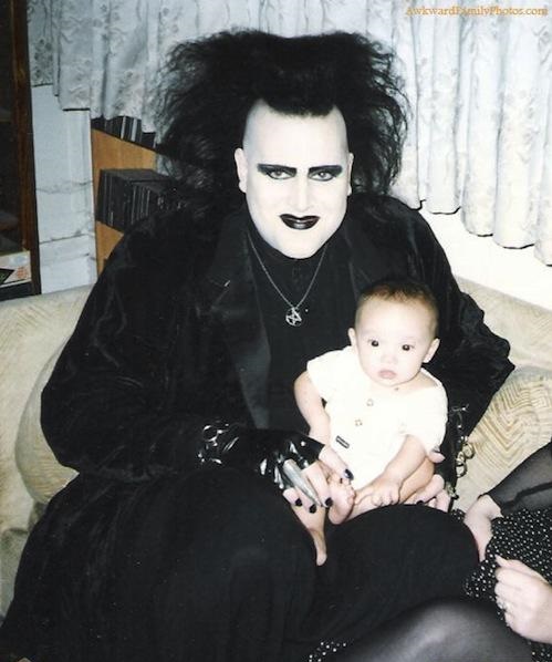 goth dad with baby - Awkward SmilyPhotos.com