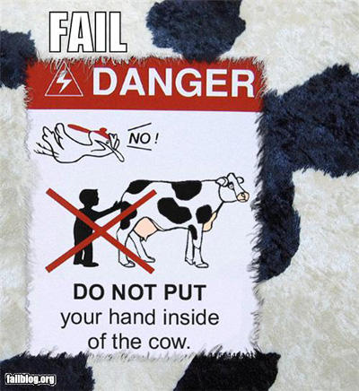 weird warning sign - Fail Danger Manual Do Not Put your hand inside of the cow. fallblog.org