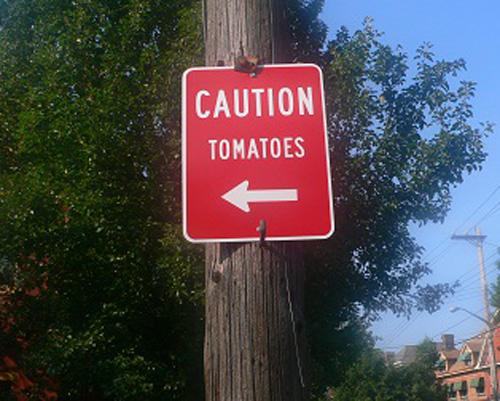 obvious sign - Caution Tomatoes